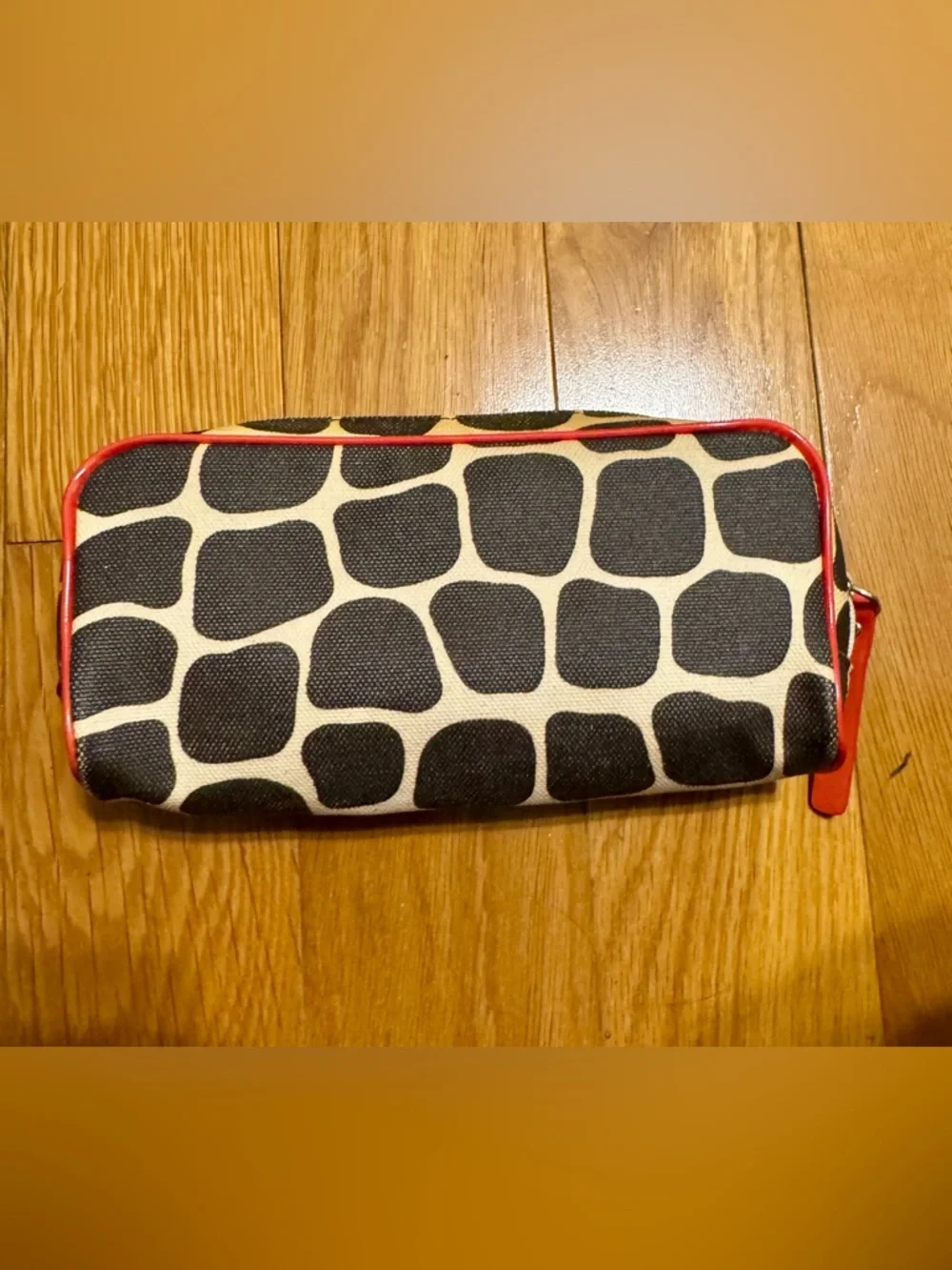 Kate Spade New York cosmetic bag or pencil case featuring a signature giraffe-